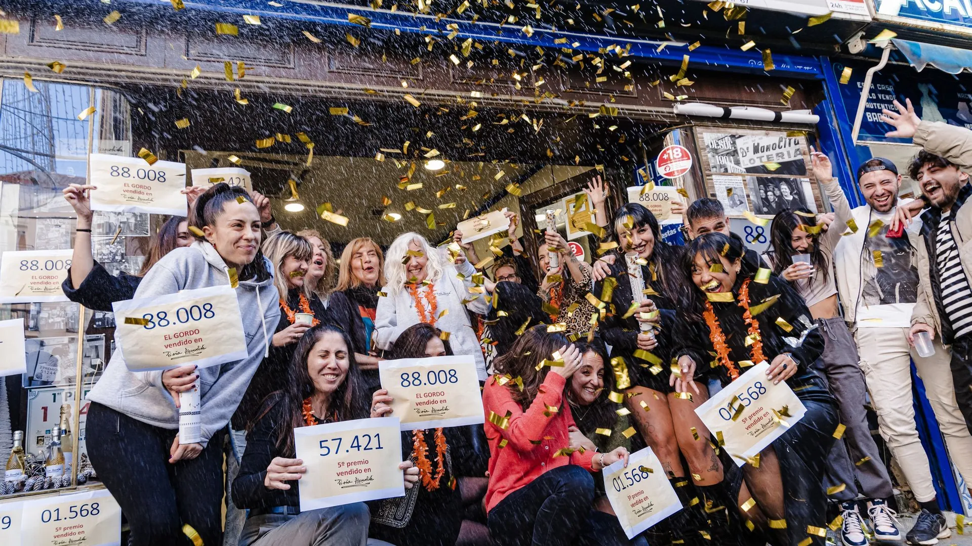 Celebration with confetti and signs.